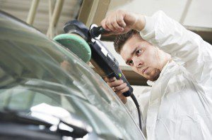 auto mechanic polishing car